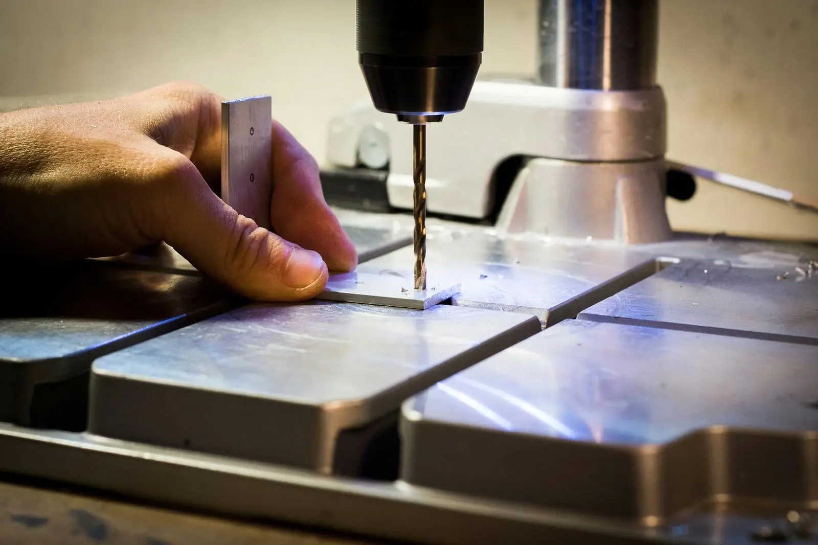 Drilling a steel plate on a drill press